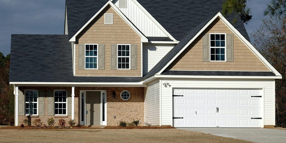 Elegant two-storey house with garage, showcasing modern architecture and residential charm.